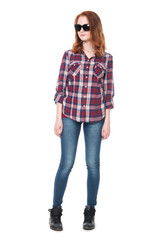 Young girl in a plaid shirt in full growth