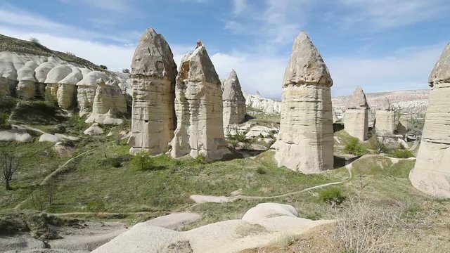 Amazing view of Turkish fortress Uchisar in the Cappadocia, Turkey. Cappadocia with its valley, ravine, hills, located between the volcanic mountains in Goreme National Park.