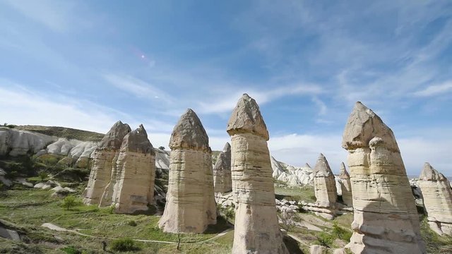 Amazing view of Turkish fortress Uchisar in the Cappadocia, Turkey. Cappadocia with its valley, ravine, hills, located between the volcanic mountains in Goreme National Park.