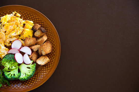 Home made fresh omelette for breakfast with vegetables vitamins. Broccoli omelette breakfast background. Fresh omelette with vitamins on plate.