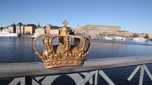 Gold Crown on Skeppsholmbron Bridge with Gamla Stan Island, Stockholm, Sweden