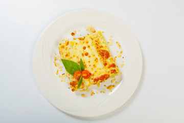 italian lasagna rolls on a white plate