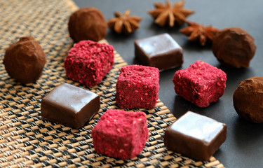 Tasty truffles on dark background