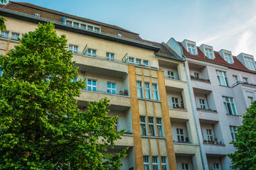 yellow and pink apartment building at prenzlauer berg