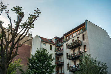 Fototapeta na wymiar rustically apartment block with colorful balconies
