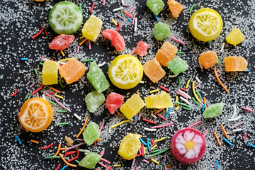 Appetizing sweets on sugarly background