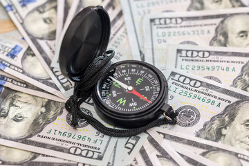 money concept - compass with dollar. close up.