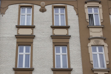 Fototapeta na wymiar Six Windows on the facade of a brick house