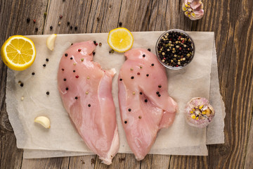 Raw chicken breasts with lemon pepper and garlic