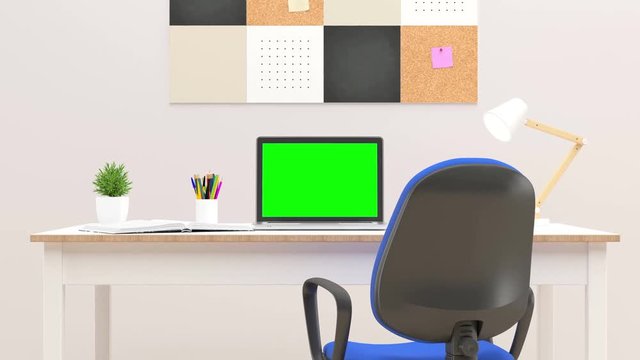Laptop with green screen in office