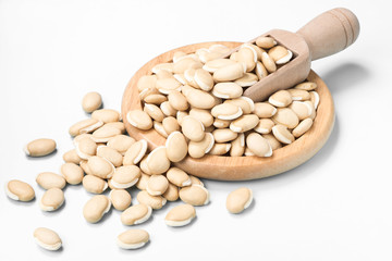 dried raw hyacinth beans on white, (large depth of field, taken with tilt shift lens)