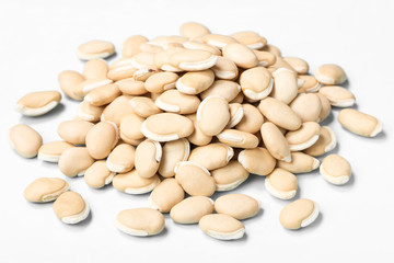 dried raw hyacinth beans on white, (large depth of field, taken with tilt shift lens)