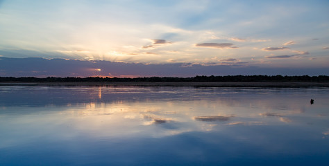 Fototapeta na wymiar sunset on the lake as a backdrop