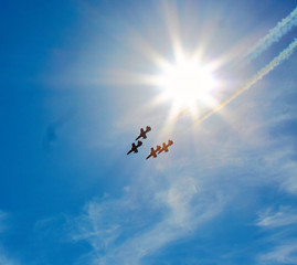 Fighter planes in the sky making a figure of aerobatics