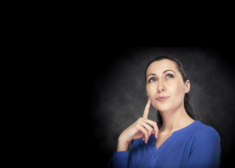 Obraz premium Serious young woman thinking about something.