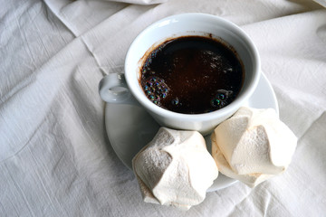 Coffee with marshmallows on tablecloths
