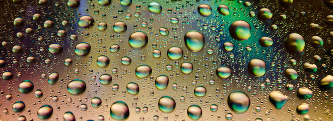 Water drops on shiny background. Long exposure