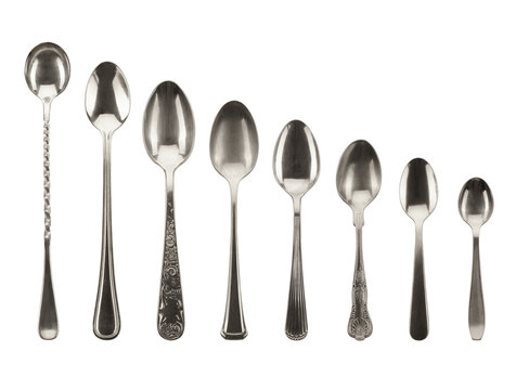 8 Different Sized Silver Toned Spoons on White Background