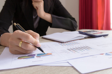 Businesswomen working with graph data at office,Finance managers task,Concept business and finance