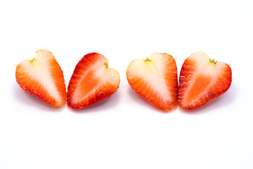 Half piece of two strawberries  isolated on white background.