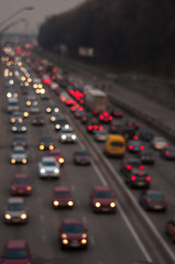 abstact blur bokeh of Evening traffic jam on road in city.