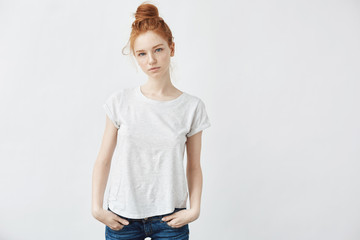 Beautiful redhead girl looking at camera. Copy space.