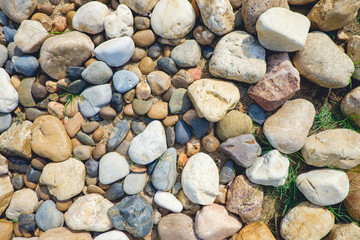 White, grey and pink pebbles abstract background, stone / rock arranged in cycle shape background, simplicity, daylight, film toned
