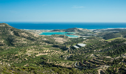 Greece, Crete, view to the green hills and sea, olives trees and sea bay