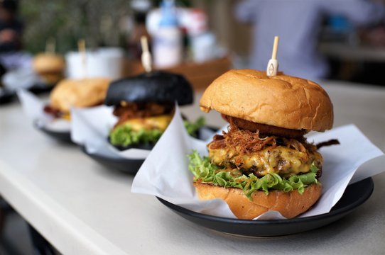 Pork cheese burger with thai style pork in brown bun