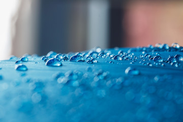 Rain Water droplets on  blue waterproof fabric