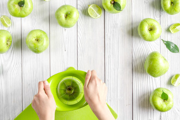 Fototapeta na wymiar Organic fruits with green apples design on white background top view