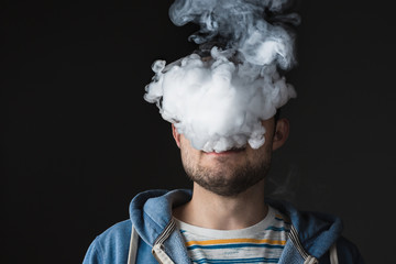 The face of vaping young man