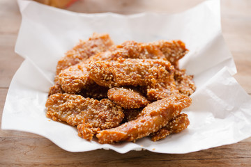 deep fried bananas with sesame on paper,thai fod