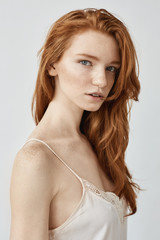 Obraz premium Fashion portrait of beautiful natural redhead girl looking at camera.