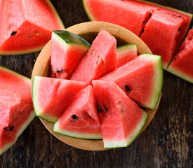 watermelon sliced on wooden background