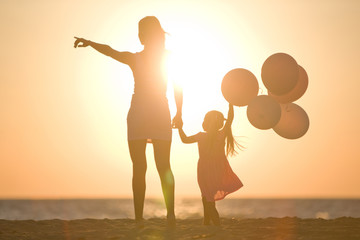 A woman with a child by the sea 