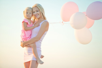 A woman with a child by the sea 
