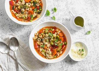 Vegetarian minestrone - delicious healthy mediterranean lunch. On a light table, flat lay