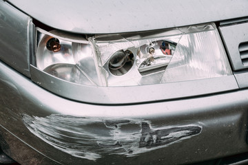 Broken Lamp Headlight And Bumper Car Scratched With Deep Damage  © Great Brut Here