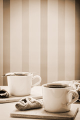 Vintage cup of coffee with crunchy cookie