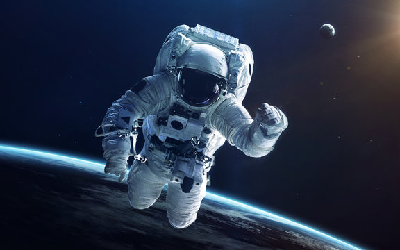 Fototapeta Astronaut in deep space. Elements of this image furnished by NASA