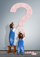 Kids question concept. Little childrens made question mark from puzzle
