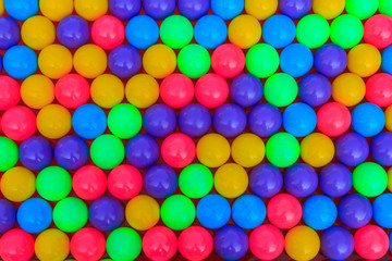group of colorfull balls on the red mosaic floor