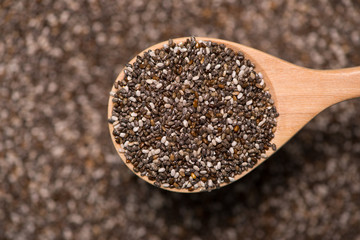 Close-up of ealthy chia seeds in a spoon. Text space.