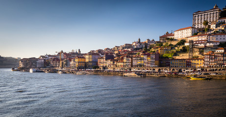 Fototapeta na wymiar Porto and its picturesque waterfron with the Douro in the foreground, Portugal