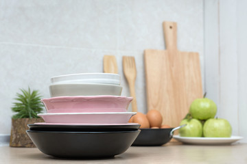 Stack Bowl after Cleansing on Wooden Table in Modern Kitchen - Housework and Home Cleansing Concept