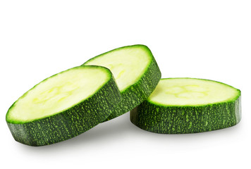 Fresh zucchini slices isolated on a white background.