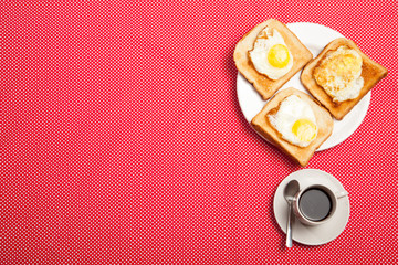 cup of coffee and toast, egg on a saucer on a red table