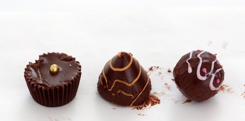 homemade chocolate bonbons closeup on white
