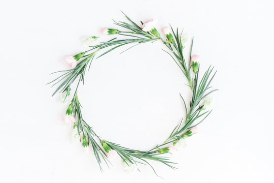 Flowers composition. Wreath made of carnation flowers on white background. Flat lay, top view.